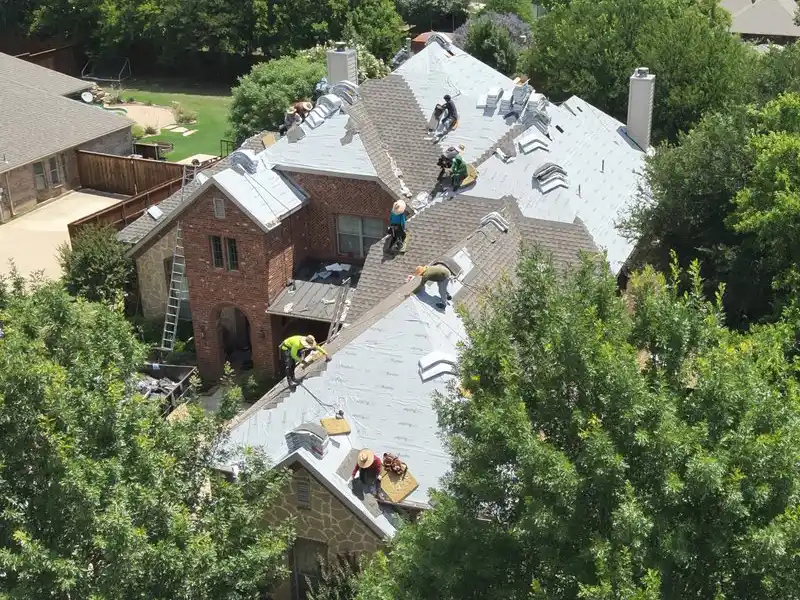 Crew members replacing a roof
