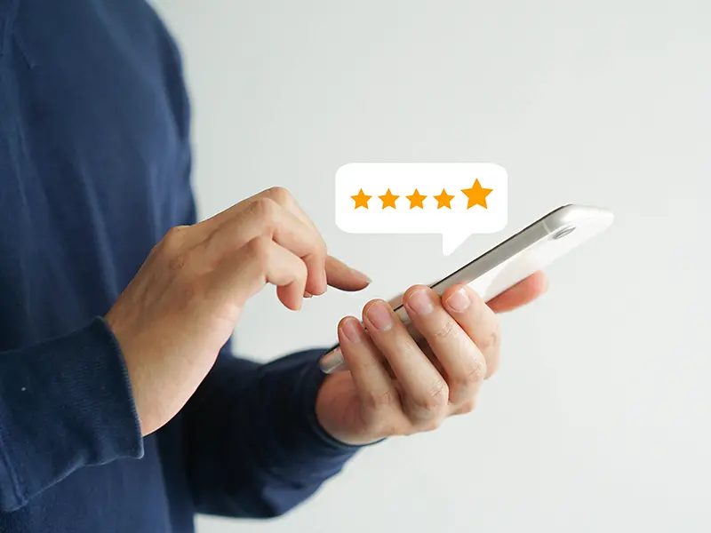 Customer leaving 5 star review on phone