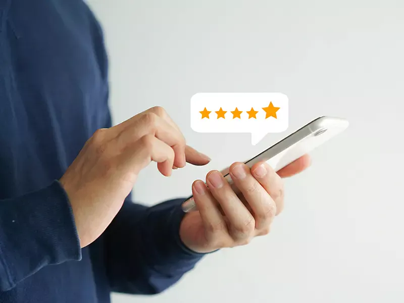 Customer leaving 5 star review on phone